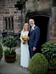 Ruth (formerly Allen) and Chris Beardmore in their wedding attire standing outside The Stafford Arms following their marriage celebration.